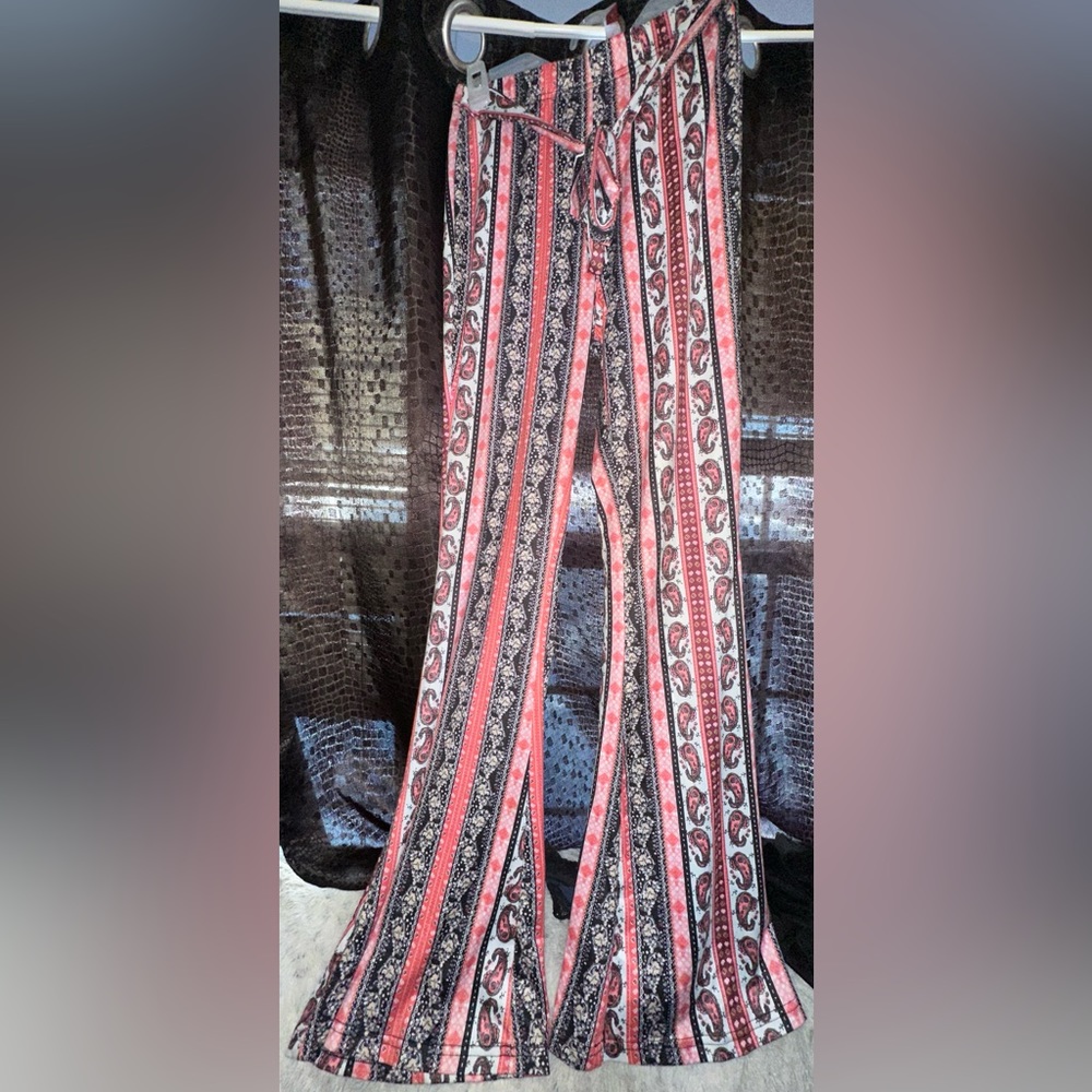 Flare pants size medium, brand is SHEIN SXY and color varies in patterns